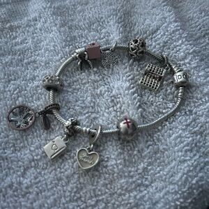 Elegant Silver pandora charm bracelet with 9 charms